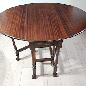 Antique Mahogany Gateleg Table: Oval Drop Leaf with Spanish Feet
