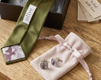 May include: Olive green tie with a photo print, a gift box, and a pair of cufflinks with a photo print, presented in a light pink drawstring bag. The tag reads "To Dad, With Love."