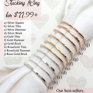 Puede incluir: Diez anillos apilables en diferentes estilos y metales, incluyendo plata, oro y oro rosa. Los anillos est&aacute;n dispuestos en una fila, con el anillo m&aacute;s peque&ntilde;o en la parte inferior y el anillo m&aacute;s grande en la parte superior. Todos los anillos est&aacute;n martillados y tienen un acabado texturizado. El texto "Add a single Stacking Ring for $11.99+ " es visible en la esquina superior izquierda de la imagen. El texto "Our best-sellers, Handcrafted, 100% Sterling Silver 14K Rose & Gold -Filled" es visible en la esquina inferior derecha de la imagen.