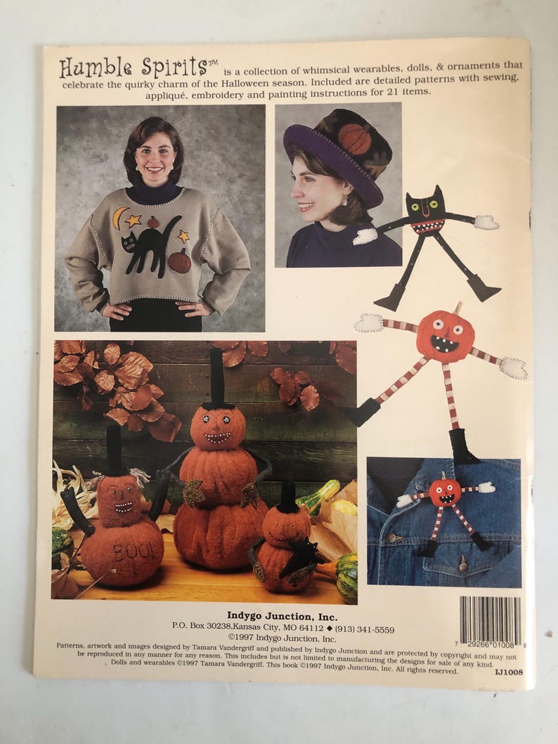 May include: A book cover featuring Halloween-themed sewing patterns. The cover includes images of a woman wearing a sweater with a black cat and a hat with a basketball design. There are also images of pumpkin-shaped dolls and the text "Humble Spirits".