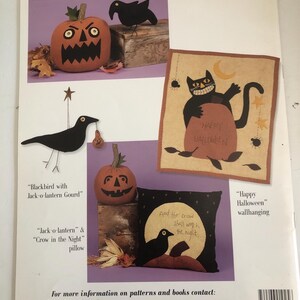 May include: A Halloween-themed craft pattern sheet featuring various designs. Includes a jack-o'-lantern, a crow, and a pillow with the text "And the crow shall work the night." Also features a wall hanging with a black cat.