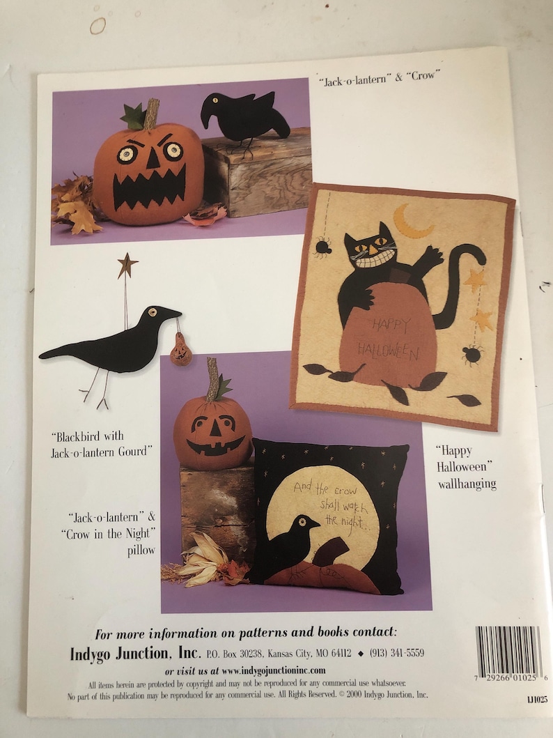 May include: A Halloween-themed craft pattern sheet featuring various designs. Includes a jack-o'-lantern, a crow, and a pillow with the text "And the crow shall work the night." Also features a wall hanging with a black cat.
