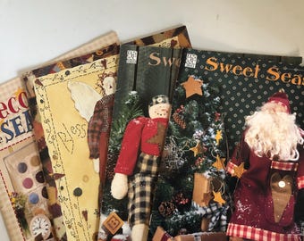 Assorted Books with Primitive Santa and Snowman Doll Patterns and other Seasonal Decor. See description for more info.