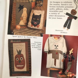 May include: A page from a craft book featuring Halloween-themed designs. It includes images of a ghost quilt, a cat pillow, a pumpkin-faced wall hanging, and a scarecrow t-shirt. The text reads "All Hallow's Eve" and "Pumpkin King."