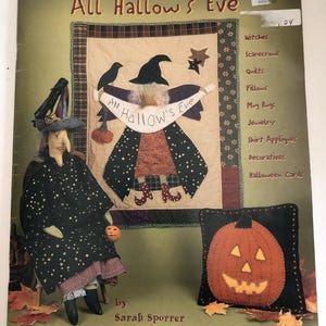 May include: A book cover titled "All Hallow's Eve" featuring a witch doll, a quilted wall hanging, and a pumpkin pillow. The cover includes a list of related items such as quilts, pillows, and jewelry. The book is by Sarah Sporrer and published by Indygo Junction, Inc.