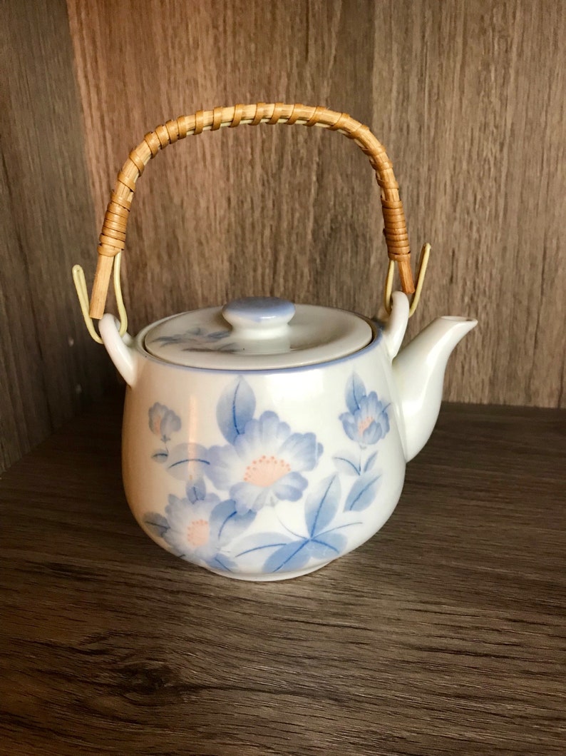 Blue flowersfloral design Vintage Asian White and Blue Teapot Ceramic Wrapped handle holds a little over 20 oz