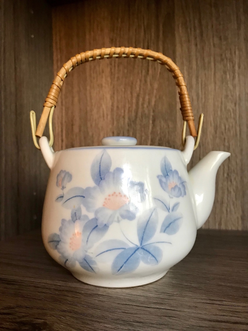 Blue flowersfloral design Vintage Asian White and Blue Teapot Ceramic Wrapped handle holds a little over 20 oz