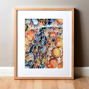 May include: Watercolor painting of a colorful abstract pattern of blue, orange, yellow, and brown shapes. The shapes are reminiscent of pebbles or stones.