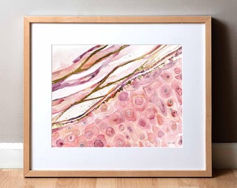 May include: Abstract watercolor painting with pink, white, and gold accents. The painting features a swirling pattern of pink and white, with gold accents throughout. The painting is framed in a light wood frame.