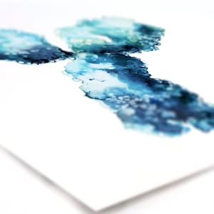 May include: Abstract watercolor painting with blue and green hues. The paint is splattered and layered, creating a unique and organic design.