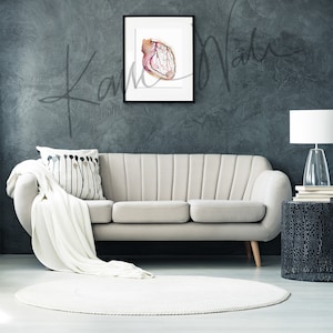 Framed watercolor painting showing a coronary angiogram x-ray image in reds, purples, greens, oranges and yellows. The painting is hanging over a beige couch.

heart art, heart painting, coronary angiogram, gift for cardiologist