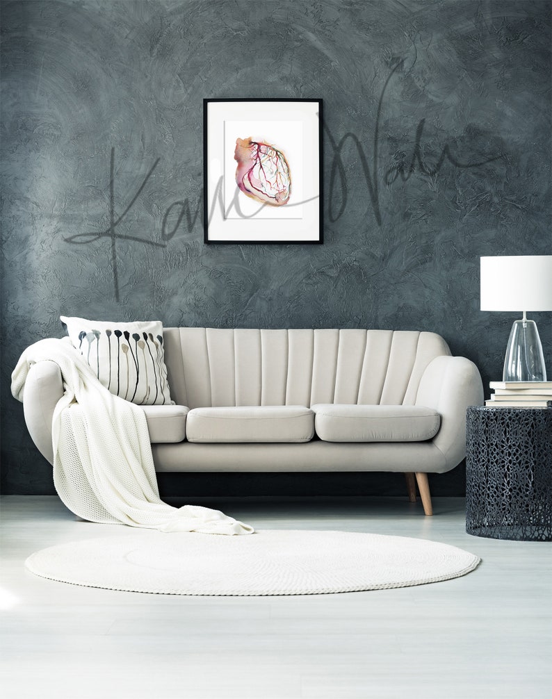 Framed watercolor painting showing a coronary angiogram x-ray image in reds, purples, greens, oranges and yellows. The painting is hanging over a beige couch.

heart art, heart painting, coronary angiogram, gift for cardiologist