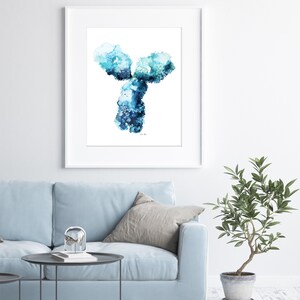 May include: A framed watercolor painting of a blue and green Y-shaped abstract design. The painting is on a white background and is framed in a white frame.