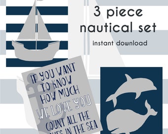 Three piece nautical boys nursery wall art with whale, dolphin and we love you quote prints.