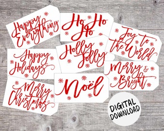 May include: A selection of white gift tags with red festive calligraphy, such as "Happy Holidays" and "Noël." Each tag is adorned with snowflake motifs. A "Digital Download" label is also visible.