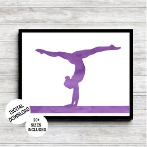May include: A framed print featuring a purple watercolor silhouette of a gymnast performing a handstand on a balance beam. The print is set against a white background and includes the text "DIGITAL DOWNLOAD" and "20+ SIZES INCLUDED".