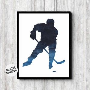 May include: A watercolor silhouette of a hockey player in blue shades, skating with a stick and puck. The image is set against a white background.