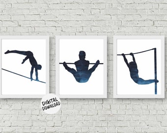 May include: Set of three framed art prints featuring watercolor silhouettes of gymnasts performing on bars and beams. The figures are in shades of blue against a white background. The prints are displayed on a white brick wall. The text "DIGITAL DOWNLOAD" is on the image.
