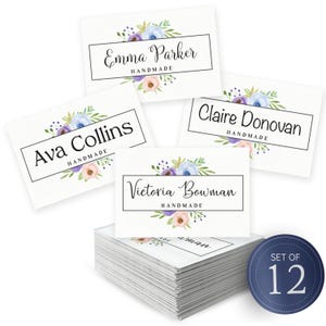 May include: A collection of white business cards featuring floral designs and names in black script. Names include Emma Parker, Ava Collins, Claire Donovan, and Victoria Bowman. A blue circle with "SET OF 12" is in the bottom right corner.