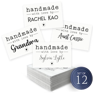 May include: A white ceramic mug with a black handle and the text "But First, Coffee" in a bold, black font. The mug is sitting on a wooden surface. The mug is approximately 4 inches tall.