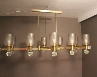 Gran araña arquitectónica de latón de forma ovalada y cristal de Murano gris de diez luces