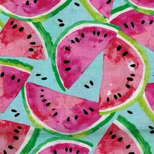 May include: A repeating pattern of pink watermelon slices on a light blue background. The watermelon slices have black seeds and green rinds.