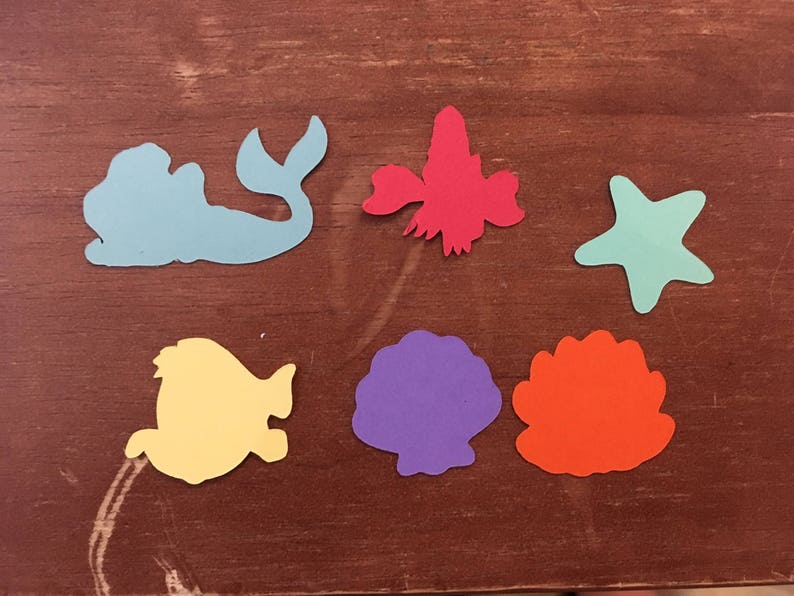 featuring Ariel Set of 6 Little Mermaid die cuts with Character Table Confetti 100 total pieces Flounder and shells Sebastian