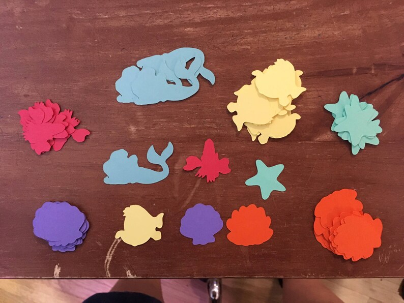 featuring Ariel Set of 6 Little Mermaid die cuts with Character Table Confetti 100 total pieces Flounder and shells Sebastian