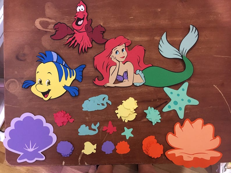 featuring Ariel Set of 6 Little Mermaid die cuts with Character Table Confetti 100 total pieces Flounder and shells Sebastian