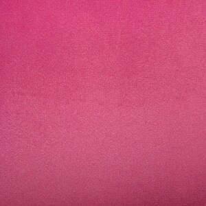 May include: A solid pink fabric with a subtle textured surface.