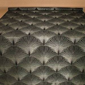 May include: Black fabric with a silver metallic pattern of repeating stylized fans.