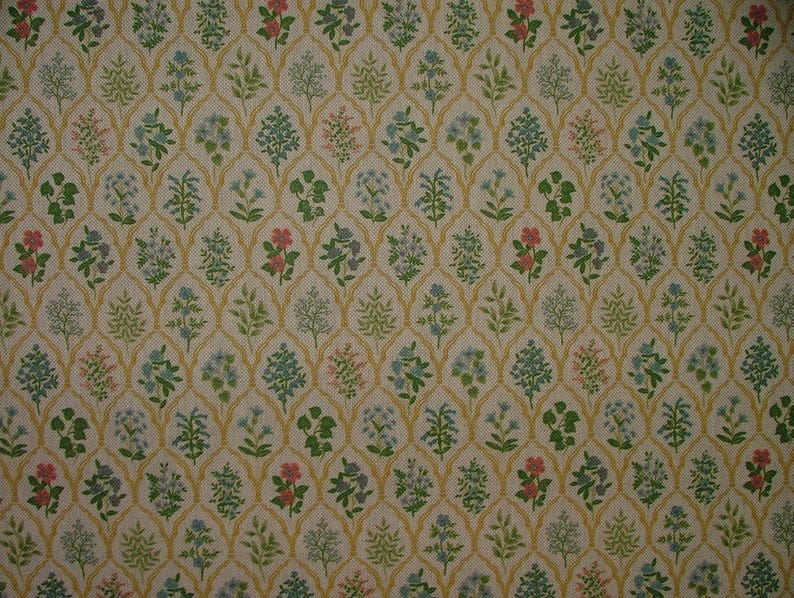 May include: A repeating pattern featuring stylized flowers and foliage in green, pink, and blue, set against a cream background. The design is framed by a gold trellis, creating a textured, vintage aesthetic. Ideal for wallpaper or fabric.
