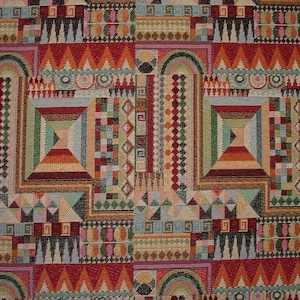 May include: A colourful tapestry featuring a geometric design in shades of red, green, blue and yellow. The pattern is made up of squares, triangles and diamonds.