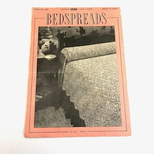 May include: Vintage magazine cover titled "BEDSPREADS" in a pink frame. The cover features a black and white image of a bed with a patterned bedspread. The magazine is labeled "BOOK No. 244" and "CLARK'S ONT J&P COATS".