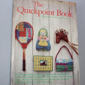 May include: The Quickpoint Book by Susan Iglehart & Barbara Schweizer. The cover features needlepoint projects: a tennis racket, doll, horse head, purse, and framed horse image. The book is on a white wooden background.