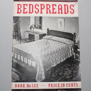 May include: A black and white photo of a bedroom with a crocheted bedspread. The bedspread is white with a delicate floral pattern. The book cover reads "Bedspreads Book No. 122 Price 10 Cents".