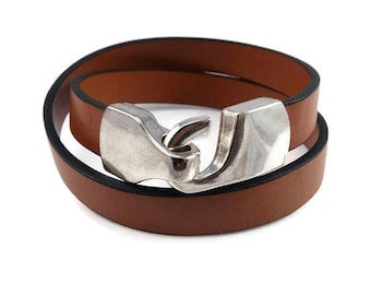 May include: A brown leather double wrap bracelet with a silver hook clasp.