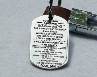 May include: Silver keychain with a message to a son, "To my son Cameron, I closed my eyes for but a moment and suddenly a man stood where a boy used to be. I may not carry you any longer in my arms but I will always carry you in my heart. You have given me so many reasons to be proud of the man you have become, but the proudest moment for me is telling others that you are my son. Love you now and forever, Love, Dad."