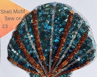 May include: A blue and brown sequined seashell applique with the text "Shell Motif Sew on £3".