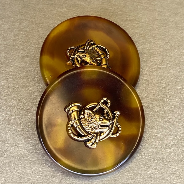 32mm metal effect Fox Head button on tortoiseshell polyester background