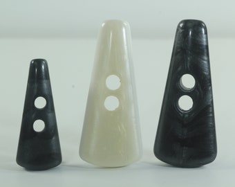 Driehoekige zwarte of crème schakelknop met platte achterkant 45 mm of 35 mm* (*alleen zwart) Parelachtige afwerking