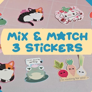 May include: A set of colorful stickers featuring various cute cartoon characters and designs. The stickers include a cat, a frog, a cow, a mushroom, a radish, a carrot, an onion, and a boba tea. The text on the stickers reads "Stay Pawsitive", "Frog-et about the sad things", "I'm rooting for you!", and "Boba best".