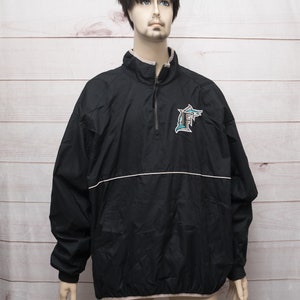 May include: Black windbreaker jacket with a white zipper and a teal and black embroidered Florida Marlins logo on the left chest.
