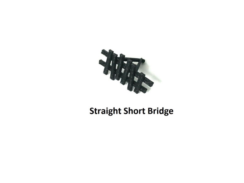 May include: Black plastic straight short bridge for a model train set.