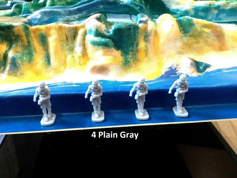 May include: Four gray plastic toy soldiers standing on a blue surface. The text "4 Plain Gray" is printed below the soldiers.