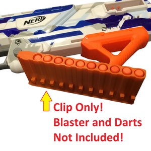 May include: Orange Nerf clip for a toy gun. The clip holds 10 darts. The text on the image reads "Clip Only! Blaster and Darts Not Included!"