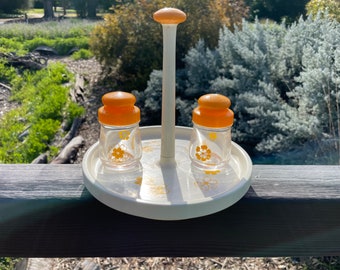 Vintage three piece set salt and pepper shakers and turning trivet happy yellow and white glass