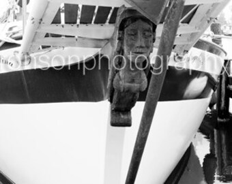 Photograph of a sailboat bust in black and white