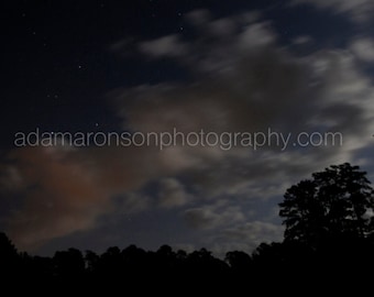 Photograph of a full moon and stars