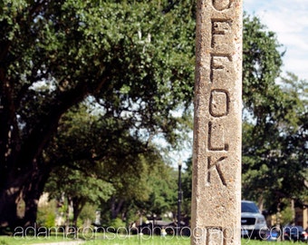 Photograph of SUFFOLK Drive cement street sign Houston, Texas.